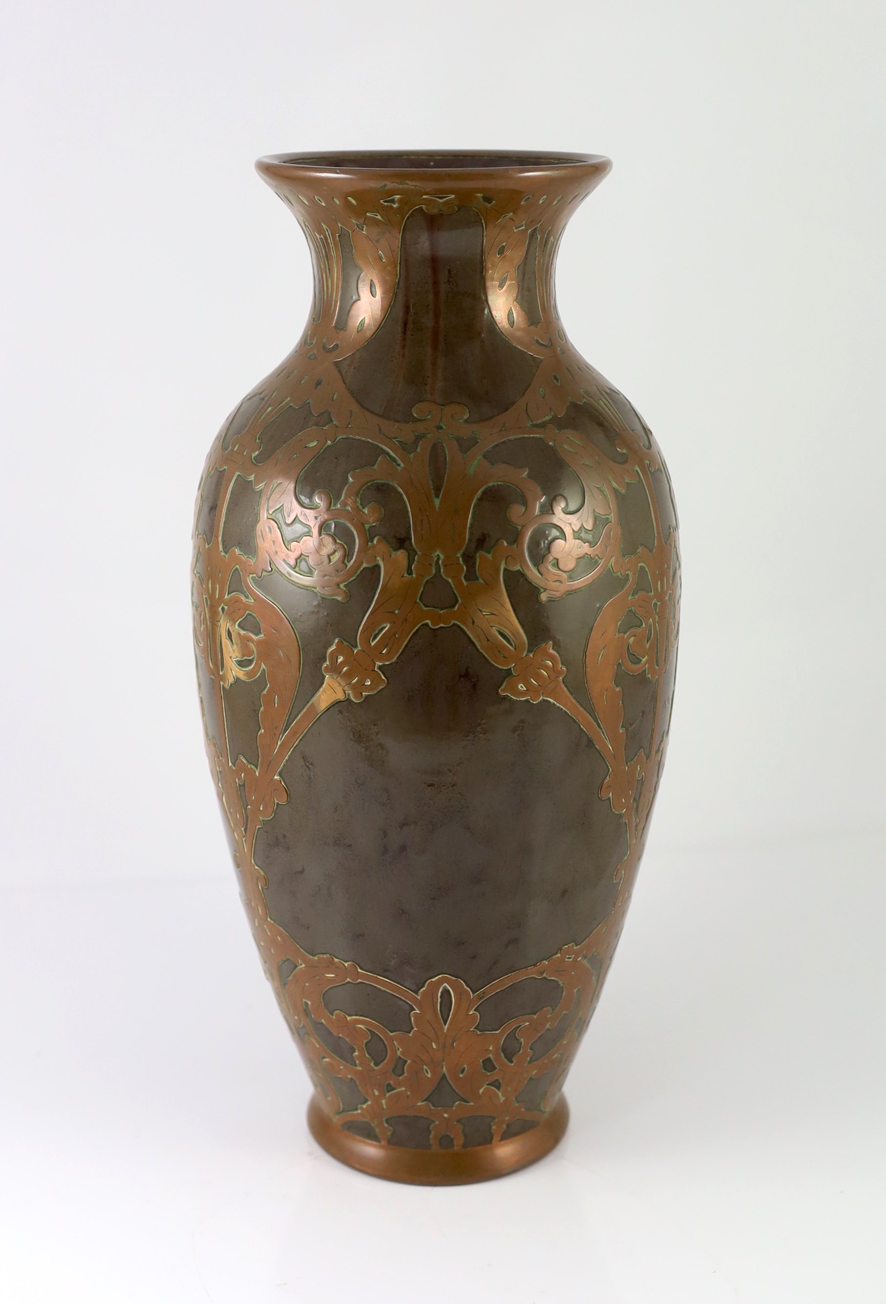 Attributed to Peter Behrens (German, 1868-1940). An Art Nouveau pottery and copper overlaid vase by Marzi & Remy, Hohr